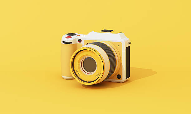istock Minimal close-up 3D rendering of a compact digital camera on a clean yellow backdrop. Ideal for tech and product themes. 3d rendering. 2219244448