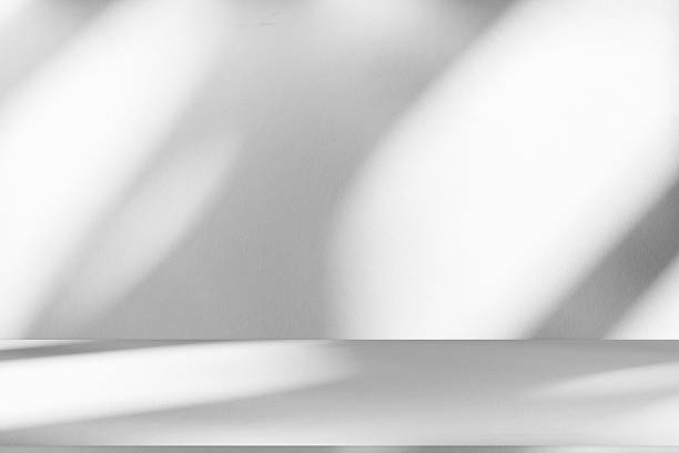 istock Wall interior background, studio and backdrops show products.with shadow from window color white . background for text insertion and presentation product 2219249006