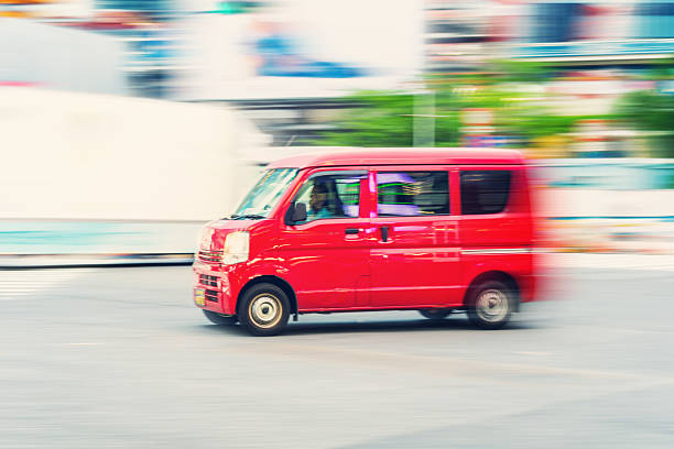 Ultra-compact red Van Driving  in Tokyo