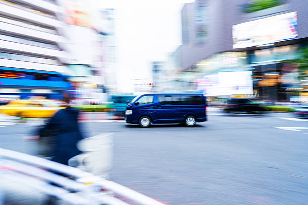 Ultra-compact blue Van Driving  in Tokyo