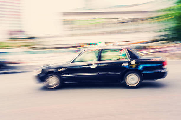 Speeding black Cab in Tokyo