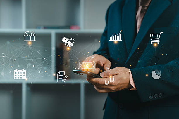 istock Businessman using a smartphone for control business management and network technology.  Network structure and business icons. Business people is working. 2219249575