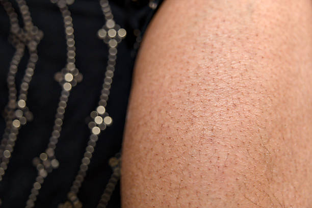 istock Close-up view of smooth leg skin with soft hair patterns 2219251709