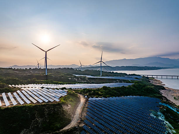 istock Solar photovoltaic windmill wind energy at sunset 2219251776