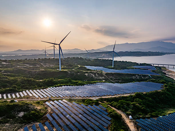 istock Solar photovoltaic windmill wind energy at sunset 2219251788