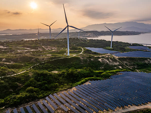 istock Solar photovoltaic windmill wind energy at sunset 2219251797
