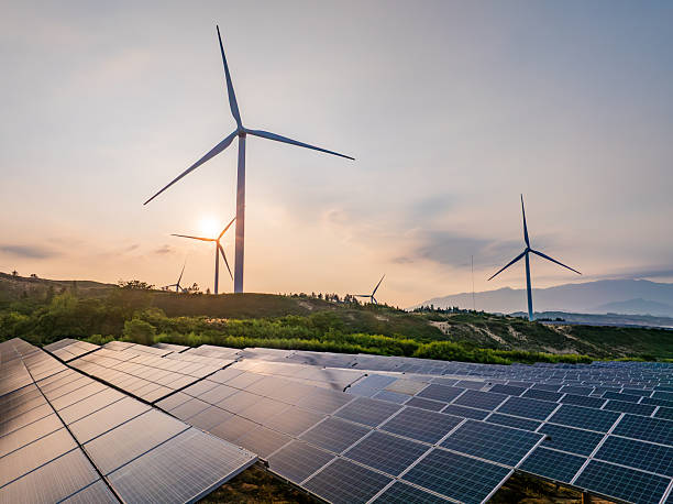 istock Solar photovoltaic windmill wind energy at sunset 2219251804