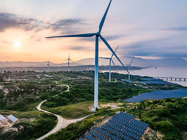 istock Solar photovoltaic windmill wind energy at sunset 2219251904