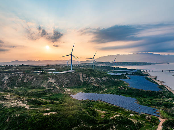 istock Solar photovoltaic windmill wind energy at sunset 2219251907