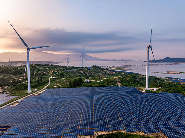 istock Solar photovoltaic windmill wind energy at sunset 2219251928