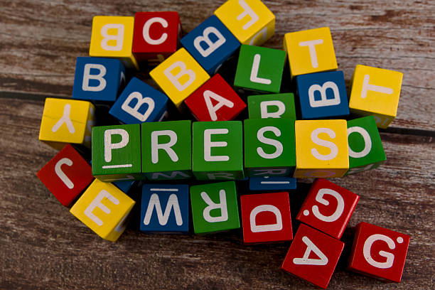 istock Colorful letter blocks arranged with the word press 2219252289