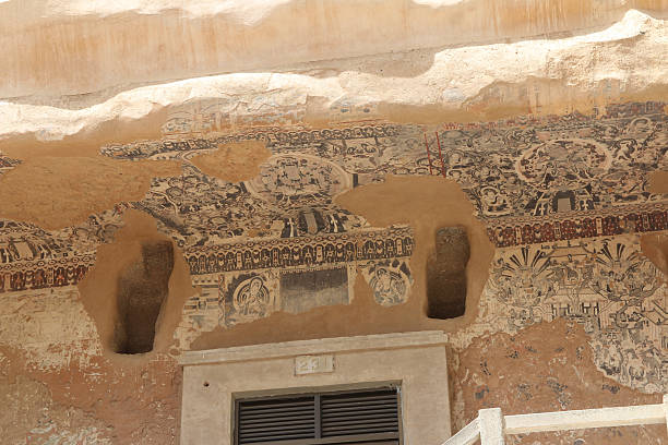 istock Marker for Cave 231 and paintings on the cave outer stone wall at Mogao Grottoes 2219252332