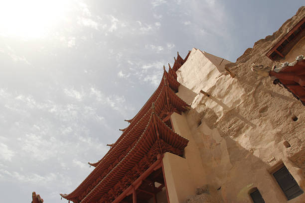 istock Ancient chinese architecture flying eaves with bells and dragon head at Mogao Grottoes 2219252367