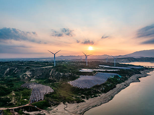 istock Solar photovoltaic windmill wind energy at sunset 2219253644