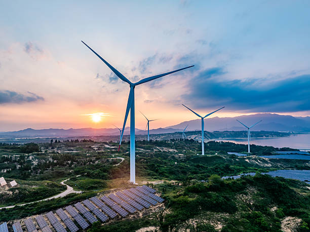 istock Solar photovoltaic windmill wind energy at sunset 2219253671