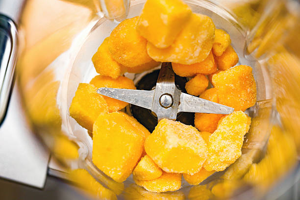 woman making fruit smoothie
