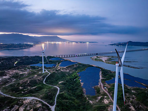 istock Solar photovoltaic windmill wind energy at sunset 2219254749