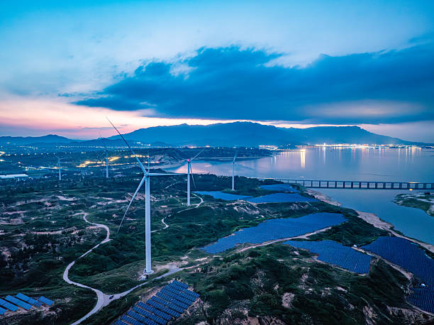 istock Solar photovoltaic windmill wind energy at sunset 2219254811