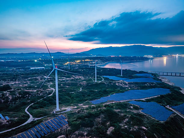 istock Solar photovoltaic windmill wind energy at sunset 2219254827