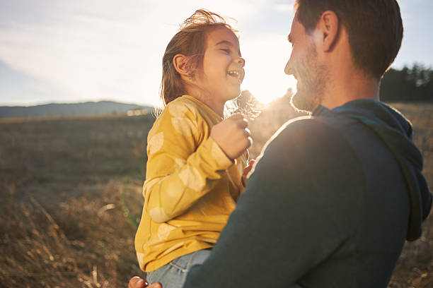 istock Happy girl in nature playing with her father 2219257628