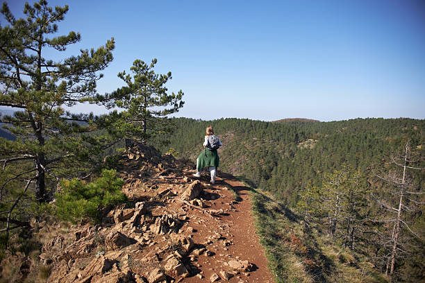 Young woman hiking mountain.