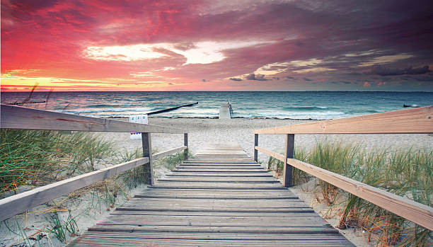 istock romantic morning at the beach, amazing sunrise 2219259767