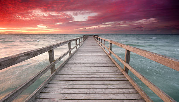 istock romantic summer evening at the beach - beautiful sunset 2219259798