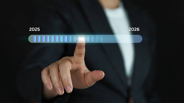 istock Concept of corporate transformation with finger touching progress bar toward 2026, reflecting marketing strategy, business planning, innovation trends 2219261045
