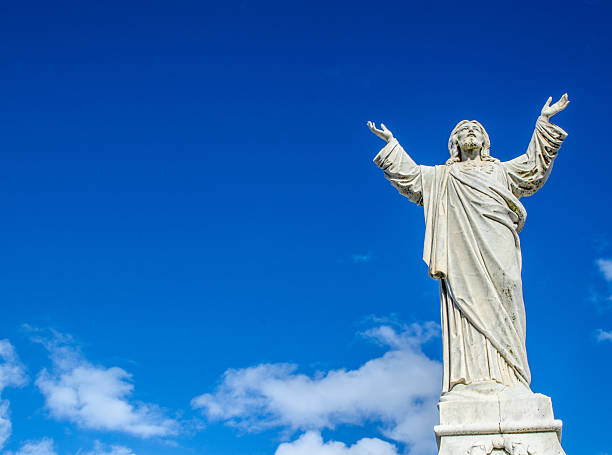 istock Jesus Christ statue standing against the blue sky. 2219262021