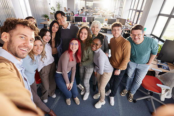 istock Happy programmers and their CEO taking a selfie in the office. 2219262373