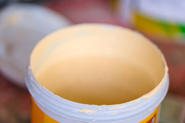 Indian young girl preparing colors for wall painting.indoor shoot at home. copy space.