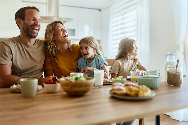 istock Cheerful family having breakfast in dining room. 2219264650
