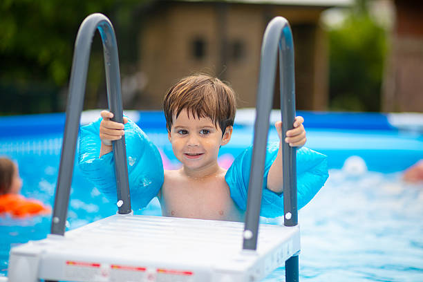 istock Getting ready to get into the swimming pool 2219264689