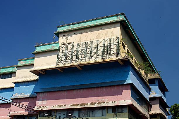 istock old building with varying colors on each floor under the blue sky. bogor 2219267022