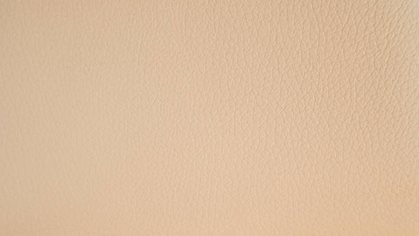 istock Light peach leather texture. Gentle and textured Peach Fuzz background 2219267061