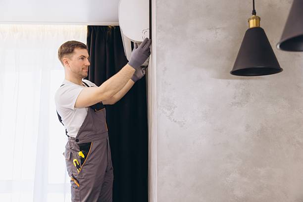 istock Professional plumber installing air conditioner in modern apartment 2219267164