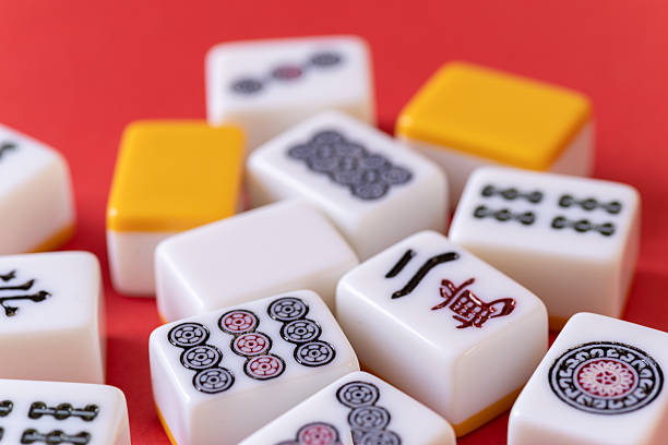 istock Mahjong tiles lined up on a red background 2219271366