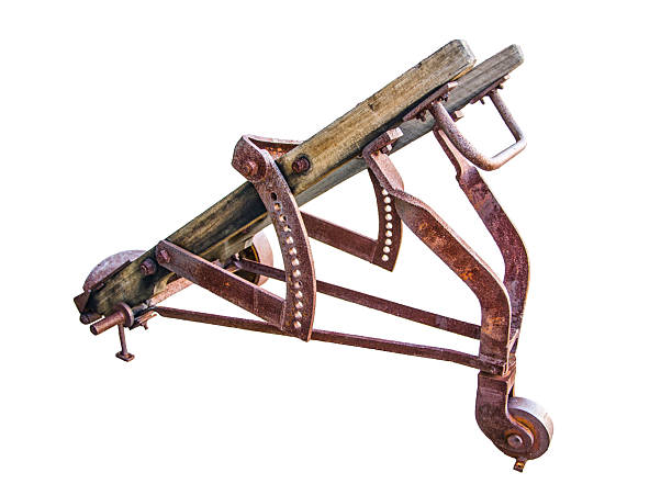 Old rusty plow on the edge of an agricultural field