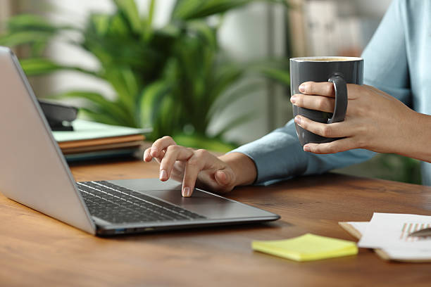 istock Woman hand working online on wooden table 2219272987