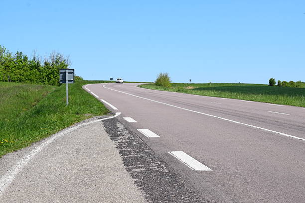 istock wide country road in spring 2219273252