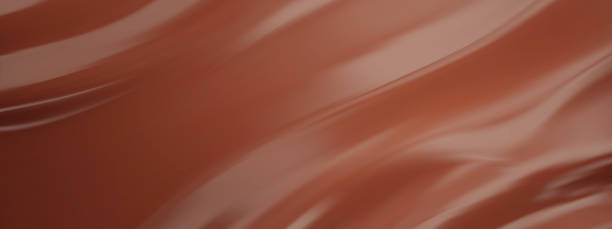 istock Wavy chocolate background. Coffee brown liquid flow with silky smooth texture and swirling mousse texture 2219275615