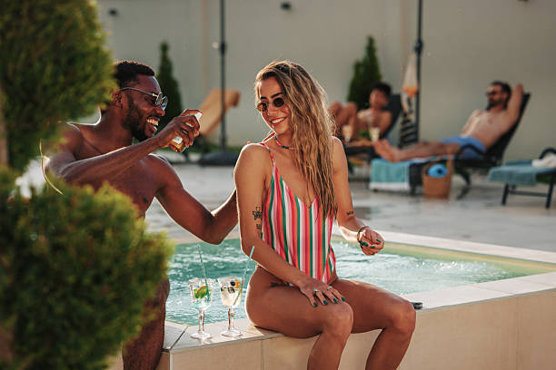 istock Friends applying sunscreen and enjoying summer pool party 2219279111