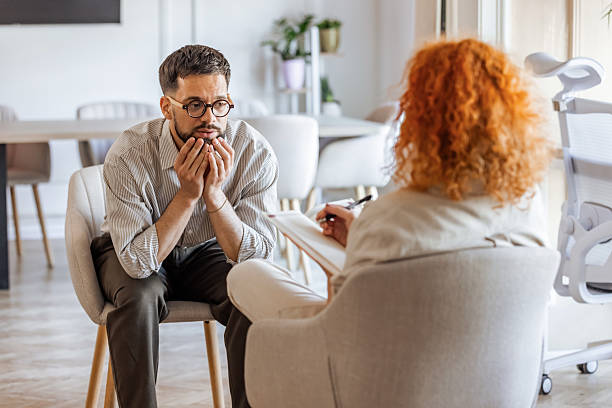Therapist and Client Engaged in an Emotional Counseling Session