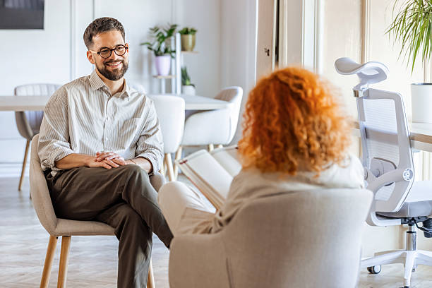 istock Two Professionals Engage in a Positive Office Conversation 2219286712