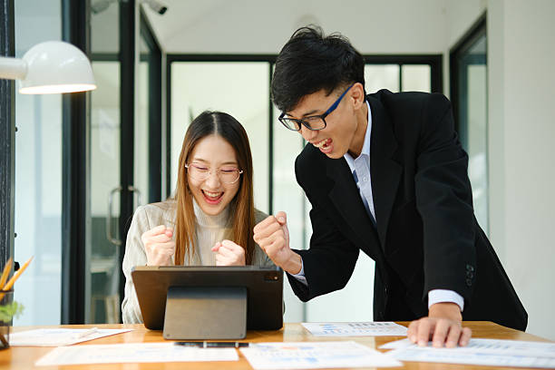 istock Young business entrepreneurs celebrating a success 2219287412