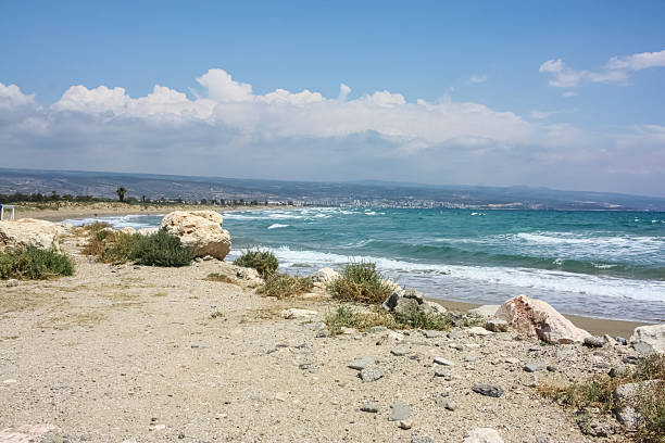 Summer inscription, ocean waves hitting rocks, sea, beach. High quality photo