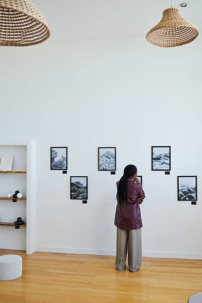 istock Viewing Black And White Photographs in Modern Gallery 2219291731
