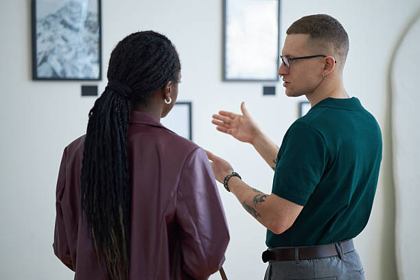 istock Discussing Art and Ideas in Modern Gallery Space 2219291741