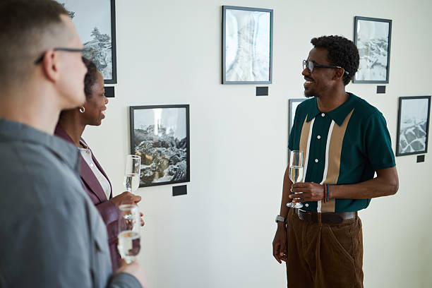 istock Discussing Art at Gallery Reception with Beverages 2219291793