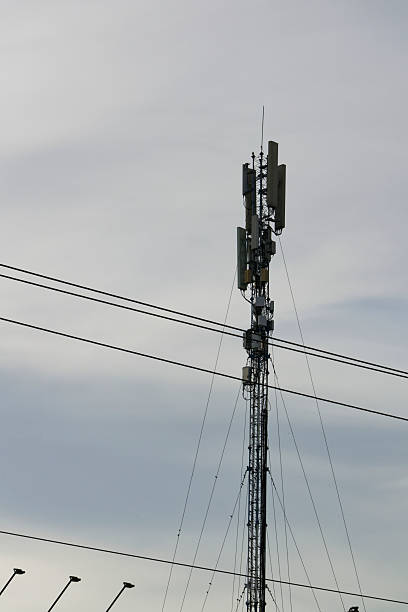 istock Telecommunication Tower Silhouetted Against a Cloudy Sky Urban Infrastructure and Modern Technology 2219293389
